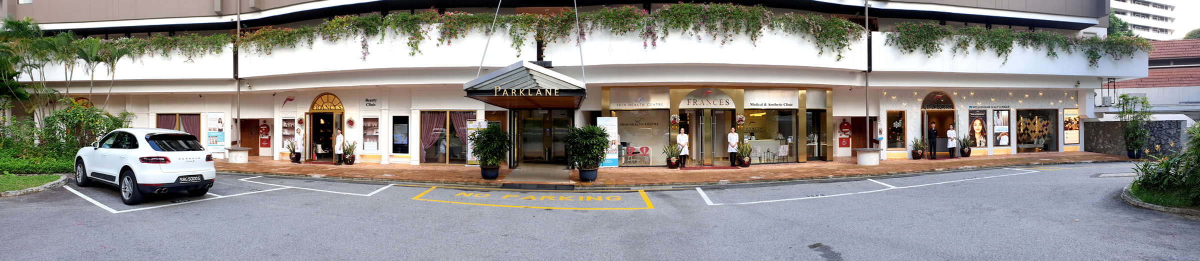 The Frances frontage — all four clinics side by side with the team at their doors